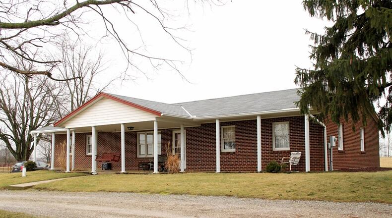 The brick ranch sits sideways along the 1,600-foot road front. The house has a covered front porch, updated kitchen, family room, hardwood floors and an unfinished basement. CONTRIBUTED PHOTOS BY KATHY TYLER