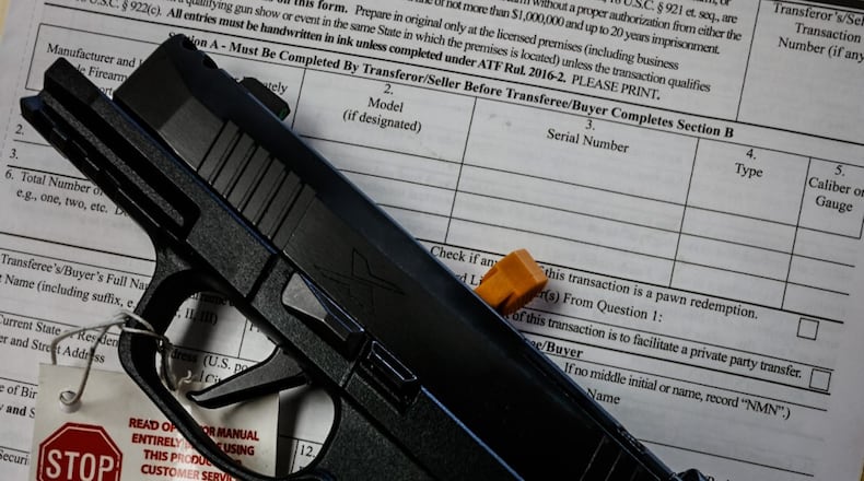 This is a firearm transaction record that is filled out prior to any gun sale at Miami Armory. JIM NOELKER/STAFF