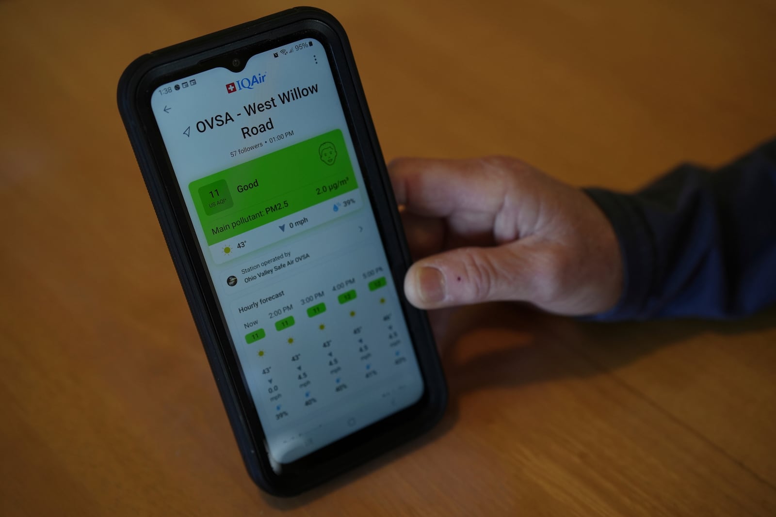 Mary Hess displays air quality data on the IQAir app on her phone Tuesday, April 8, 2025, in Dale, Ind. (AP Photo/Joshua A. Bickel)
