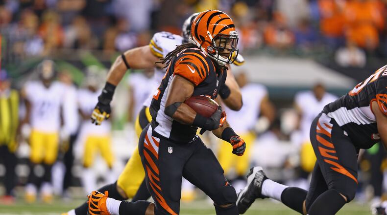 CINCINNATI, OH - SEPTEMBER 16: BenJarvus Green-Ellis #42 of the Cincinnati Bengals runs with the ball during the NFL game against the Pittsburgh Steelers at Paul Brown Stadium on September 16, 2013 in Cincinnati, Ohio. (Photo by Andy Lyons/Getty Images)