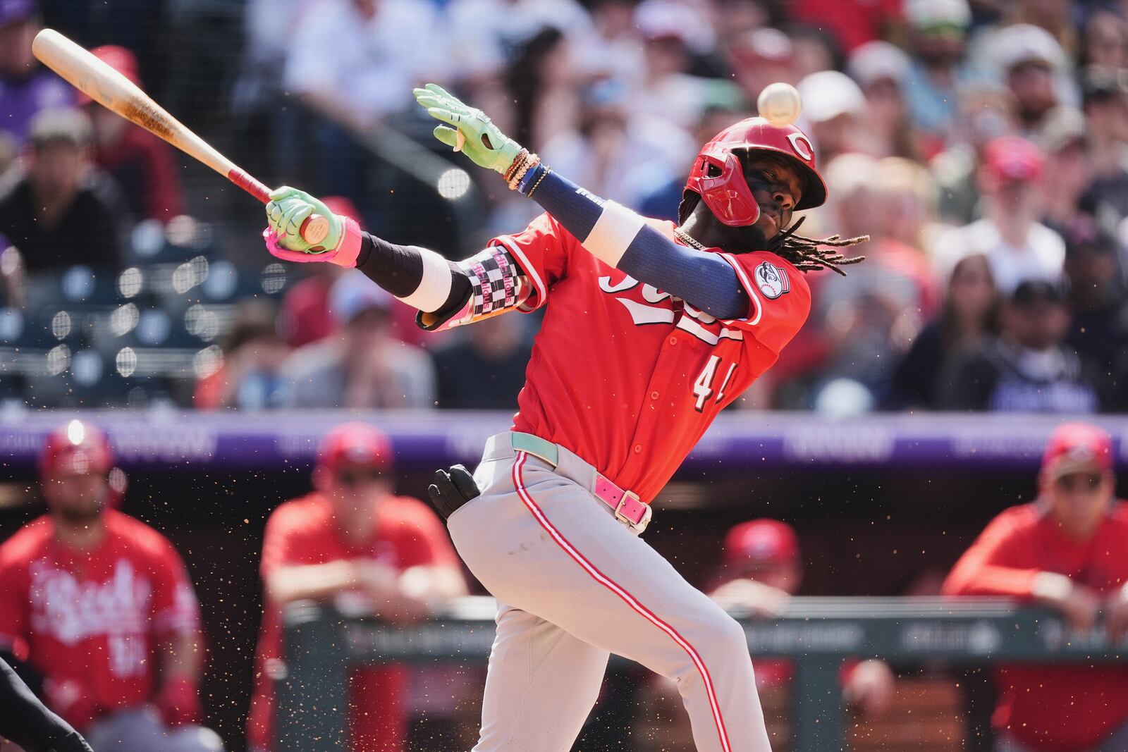 Cincinnati Reds' Elly De La Cruz fouls off a pitch from Colorado Rockies relief pitcher Tyler Kinley in the ninth inning of a baseball game Saturday, April 26, 2025, in Denver. (AP Photo/David Zalubowski)