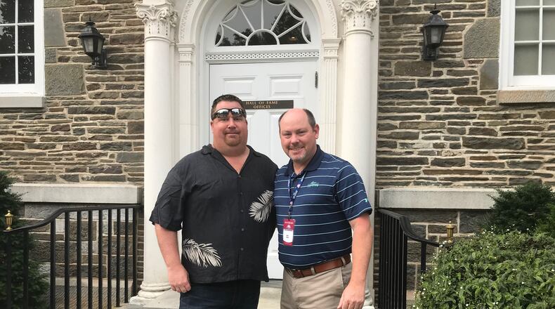 Mark Bowman, left, and Atlanta Braves media relations director Brad Hainje stand outside the Baseball Hall of Fame in 2018, the year Chipper Jones was inducted.