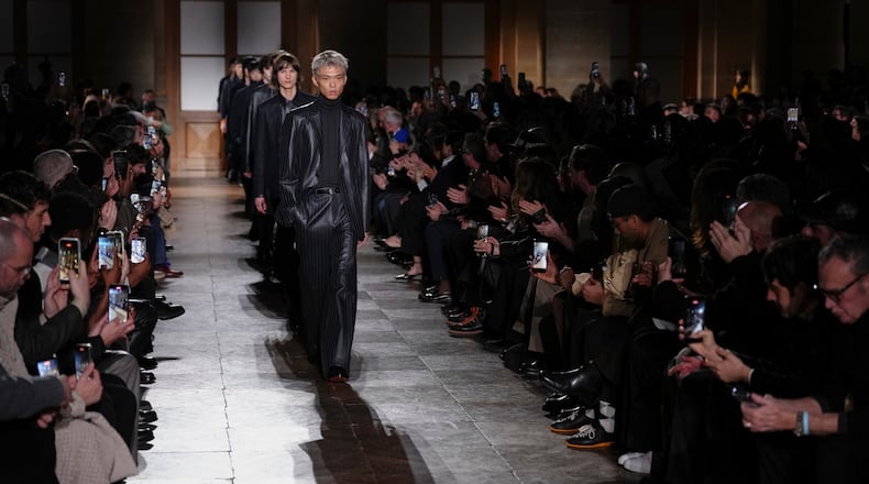 Models wear creations as part of the Hermes Fall/Winter 2026-2027 Men's collection presented in Paris, Saturday, Jan. 24, 2026. (AP Photo/Aurelien Morissard)