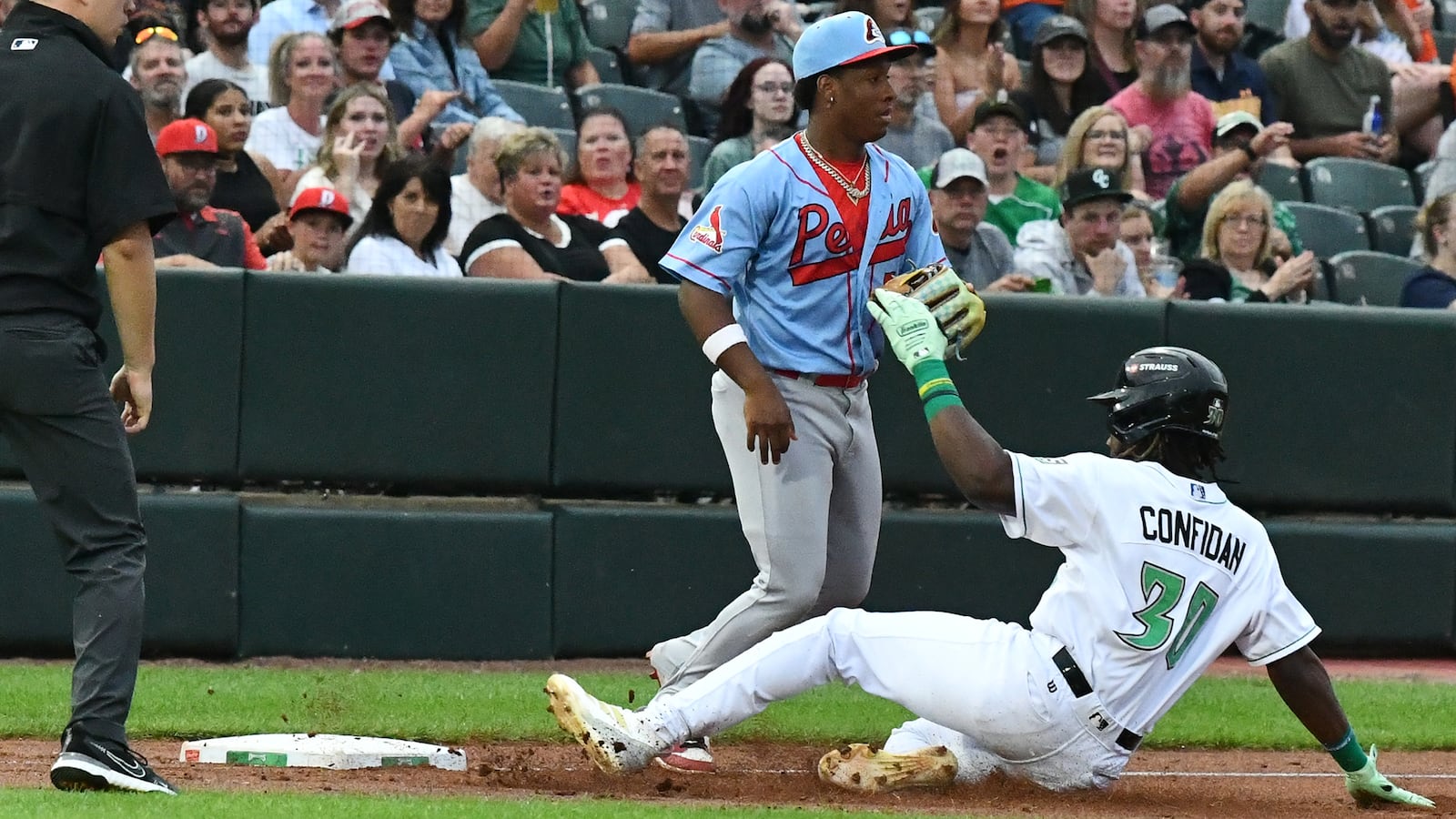 Dayton's Yerlin Confidan slides for a third-inning triple Saturday night at Day Air Ballpark. JEFF GILBERT/CONTRIBUTED