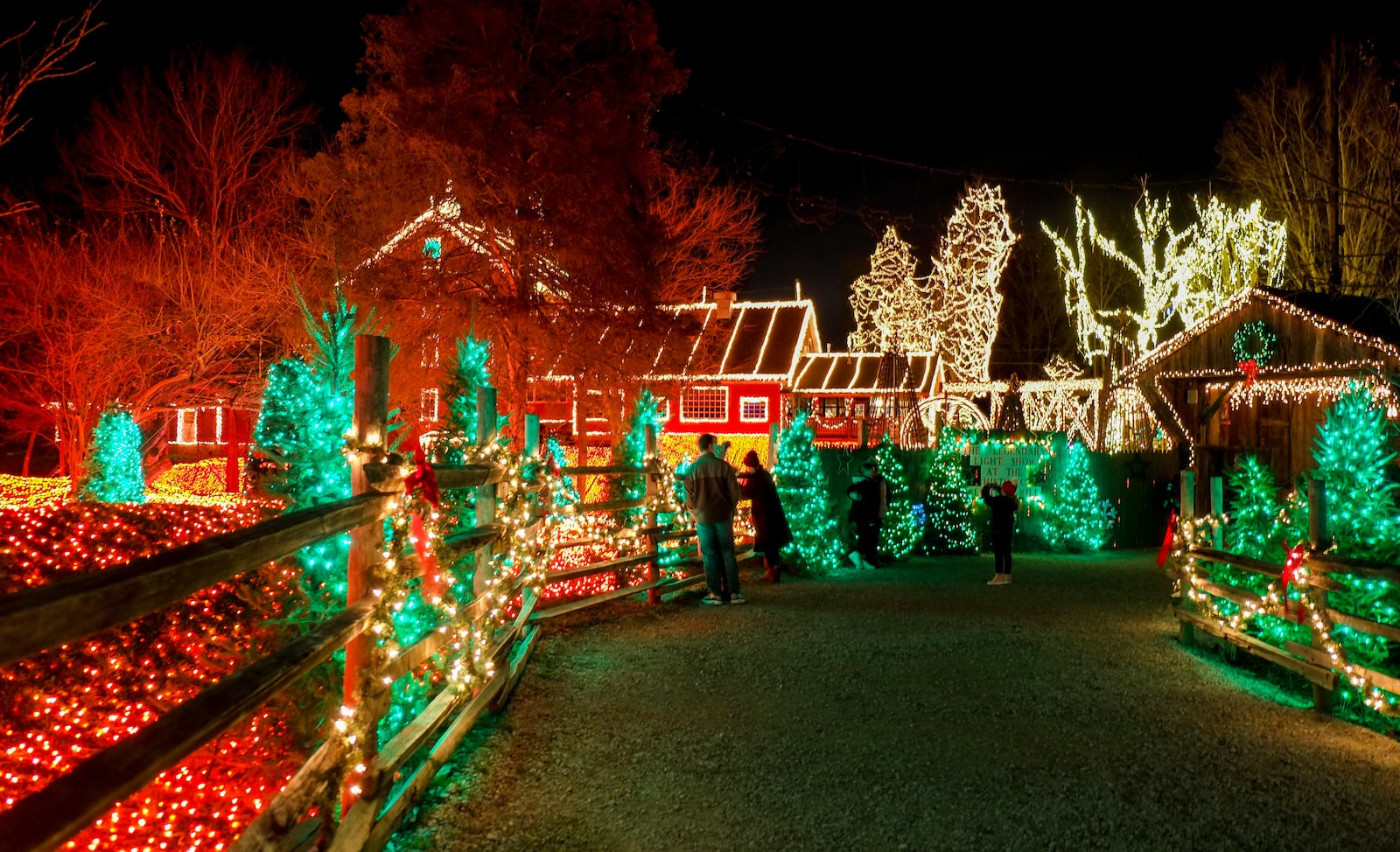 Visitors take in the Legendary Lights at the historic Clifton Mill, just outside Yellow Springs, Friday, Dec. 2, 2022. The mill, built in 1802 and still a working, has become a Miami Valley institution around the holidays. GREG LYNCH / STAFF