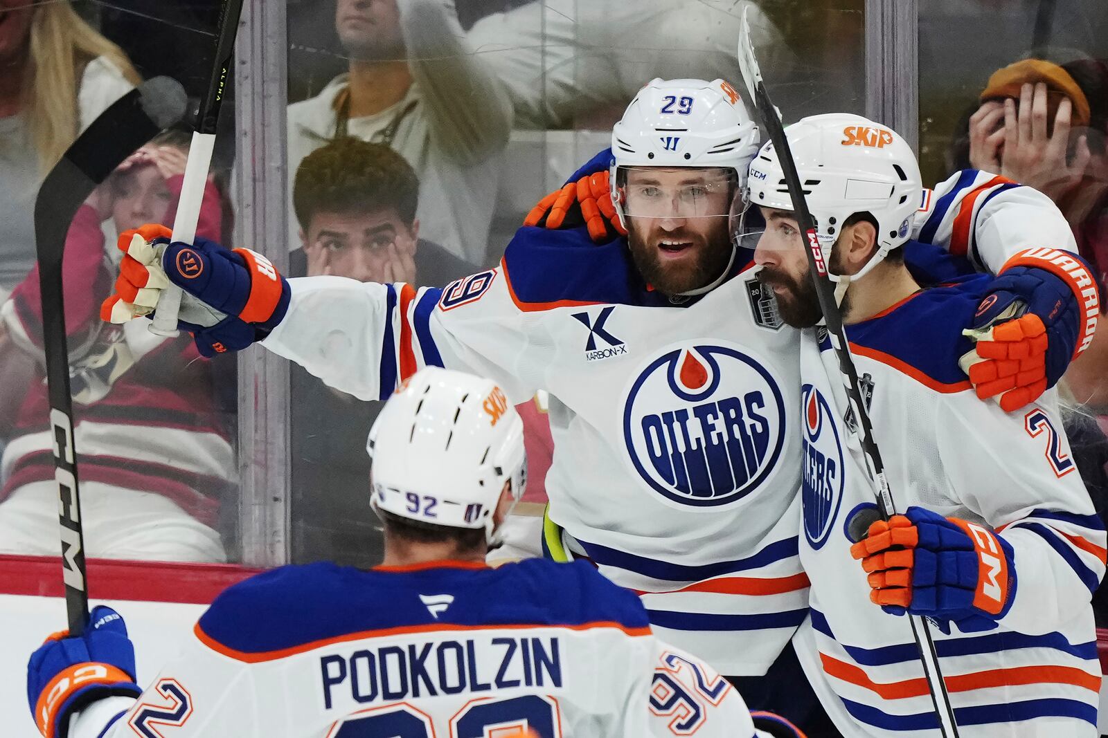 Edmonton Oilers' Leon Draisaitl (29) celebrates after his winning goal against the Florida Panthers with Evan Bouchard (2) during the first overtime period in Game 4 of the NHL hockey Stanley Cup Final in Sunrise, Fla., Thursday, June 12, 2025. (Nathan Denette/The Canadian Press via AP)