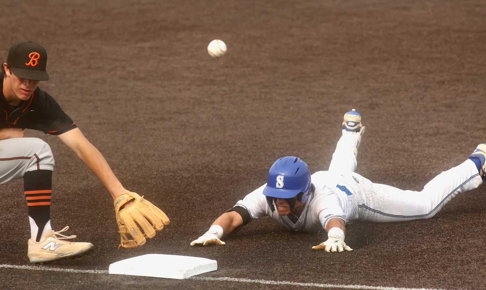 Springboro's Jacob Cane slides into third base with a three-run triple in the second inning against Beavercreek in a Division I regional semifinal on Wednesday, June 4, 2025, at Miami University's McKie Field in Oxford. David Jablonski/Staff