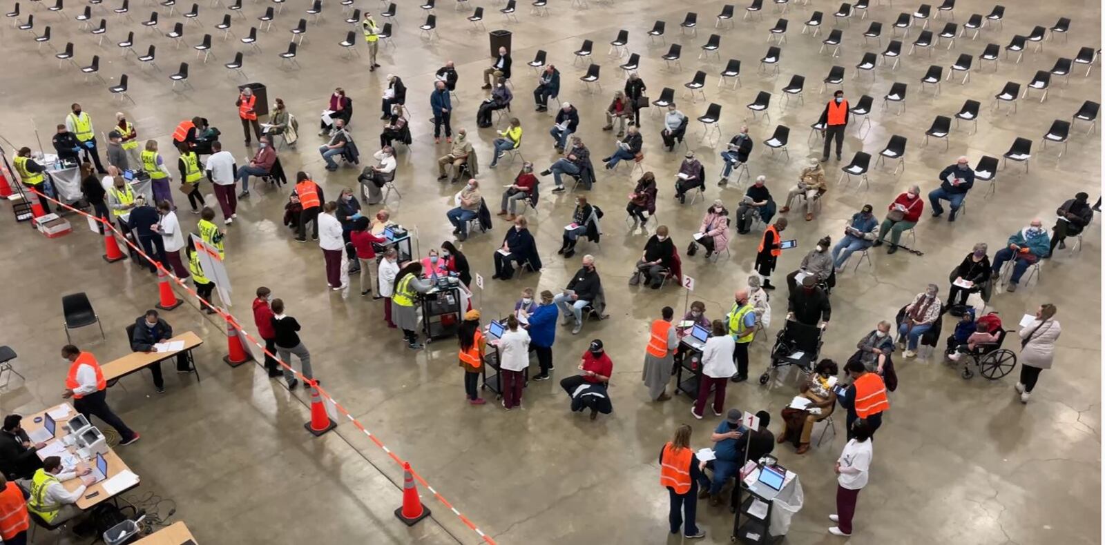 People wait it line on Wednesday at the Dayton Convention Center to receive a COVID-19 vaccine. Contributed