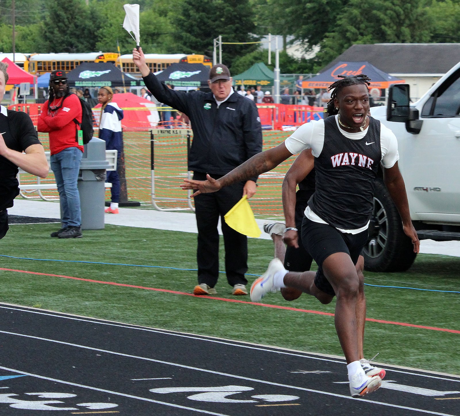 Wayne's Jamier Averette-Brown wins the 100 during the Division I Region 4 track finals at Wayne's Heidkamp Stadium. HENRY S. CONTE / CONTRIBUTED PHOTO