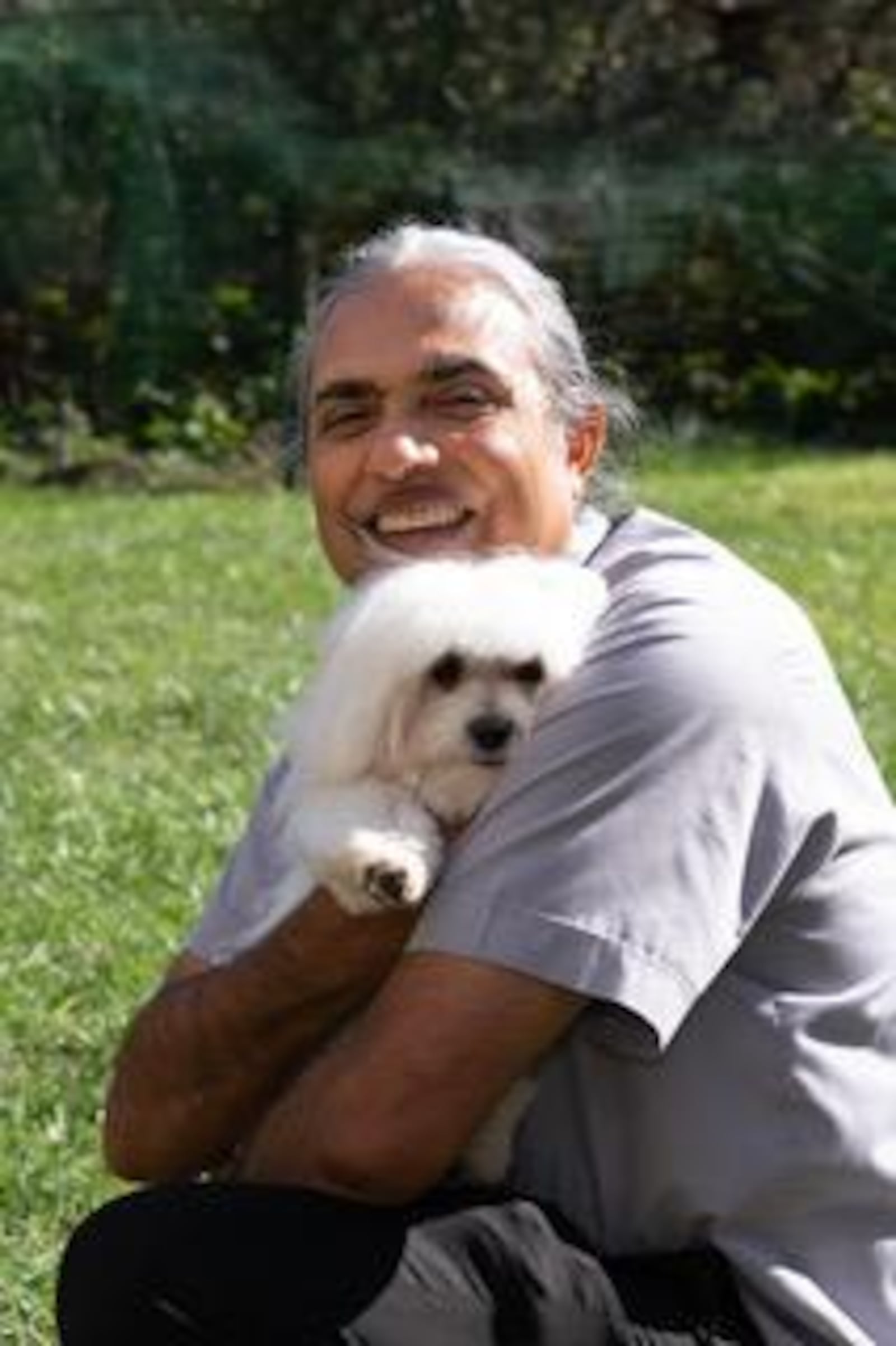Father Satish Joseph with his beloved Maltese Tutu, who was the inspiration for the MercyPets charity. Tutu died not long ago at age 13. CONTRIBUTED PHOTO