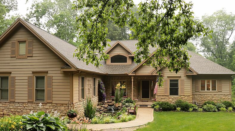 The brick-and-stone ranch has about 4,410 sq. ft. of living space. The open concept, split-floor plan design has a full, finished, walk-out lower level that has a multipurpose floor plan design. CONTRIBUTED PHOTO BY KATHY TYLER