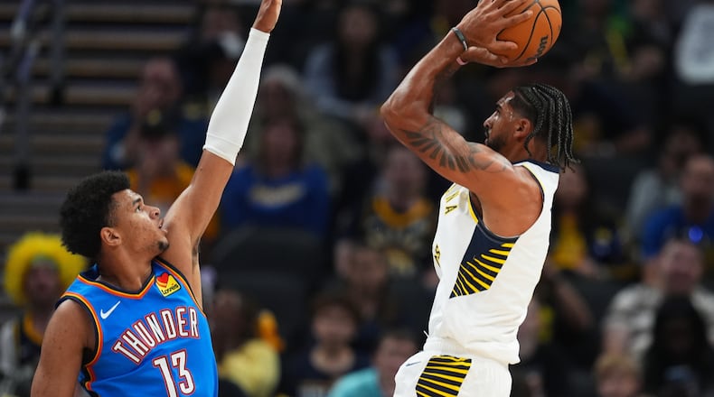 Indiana Pacers' Obi Toppin shoots over Oklahoma City Thunder's Ousmane Dieng during the first half of an NBA preseason basketball game, Saturday, Oct. 11, 2025, in Indianapolis. (AP Photo/Darron Cummings)