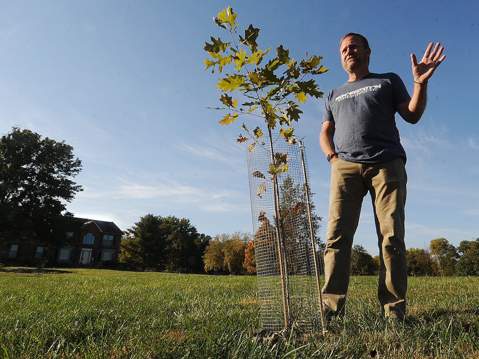 Patrick Higgins, talks about reforesting his property in Sugarcreek Twp. MARSHALL GORBY\STAFF