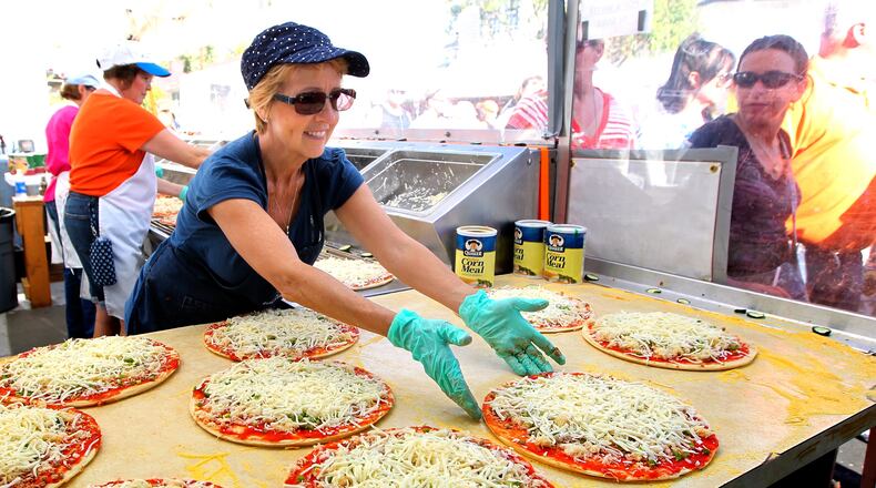 Sauerkraut pizza is one of the local delicacies peddled at the Ohio Sauerkraut Festival in Waynesville. STAFF/NICK DAGGY