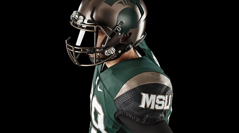 Influenced by Spartan shields, the new Michigan State uniform incorporates bronze fixtures - including on the helmet - throughout the design.
