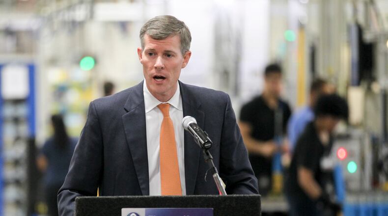 John Minor, president of JobsOhio, spoke at the 2014 groundbreaking for the expansion at ThyssenKrupp Bilstein of America. GREG LYNCH / STAFF