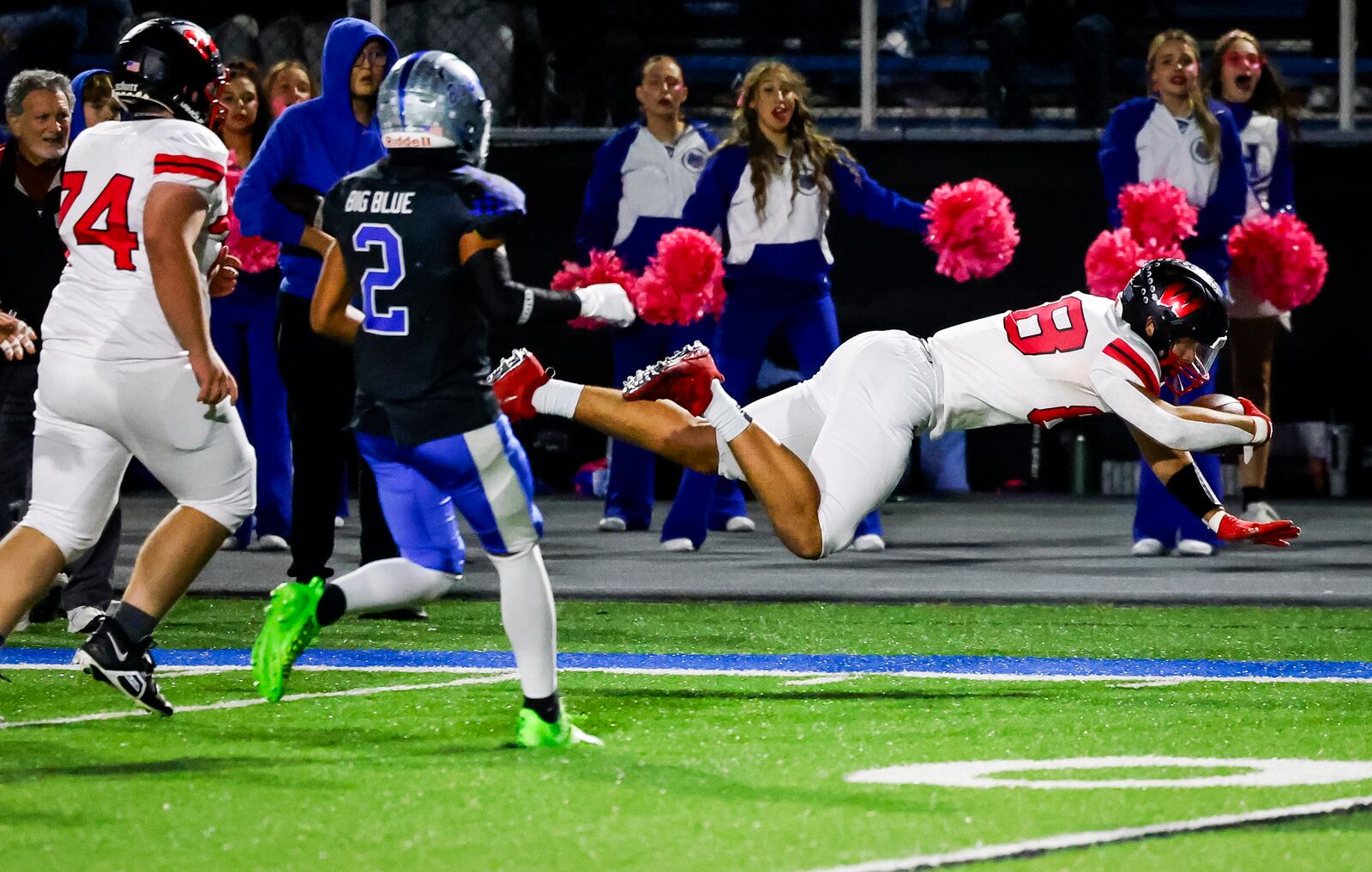 Lakota West's Luka Gilbert dives for extra yards during their football game against Hamilton Friday, Oct. 20, 2023 at Virgil M. Schwarm Stadium in Hamilton. Lakota West won 42-14. NICK GRAHAM/STAFF