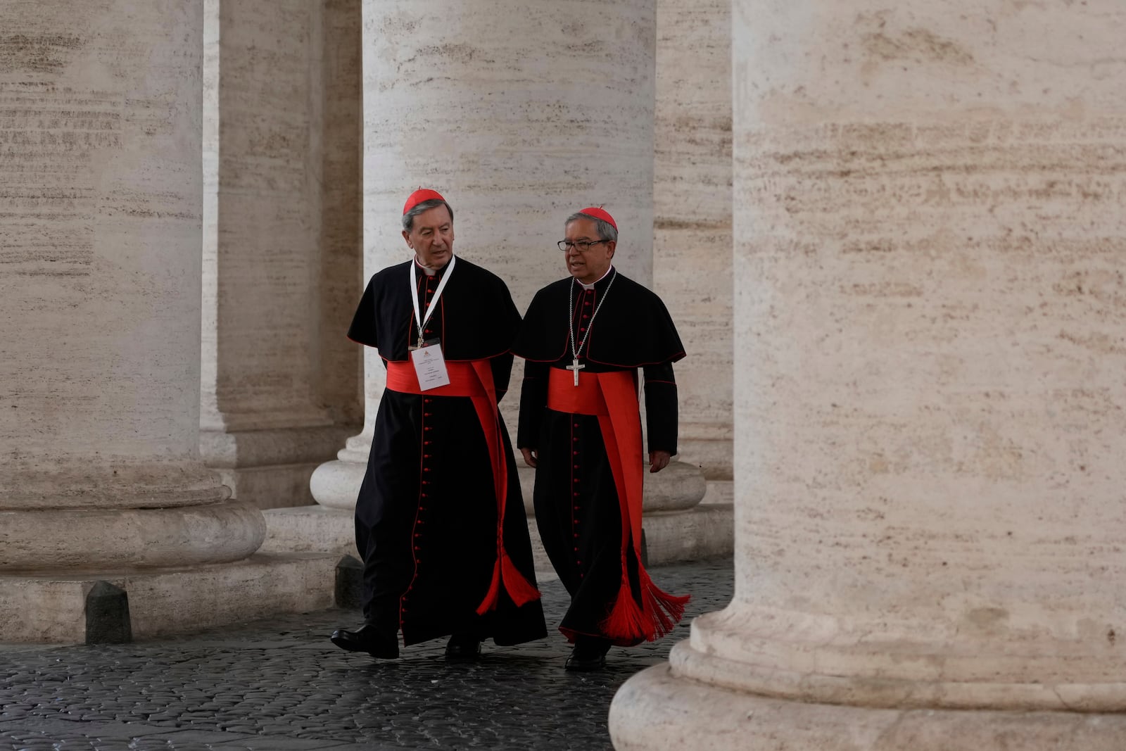 Cardinals Ruben Salazar Gomez, left is flanked by Cardinal Luis José Rueda Aparicio as they arrive in the New Hall of the Synod at the Vatican, Tuesday, May 6, 2025, the last time before the start of the conclave starting in the afternoon of Wenesday, May 7, when they will elect the successor of Pope Francis. (AP Photo/Gregorio Borgia)