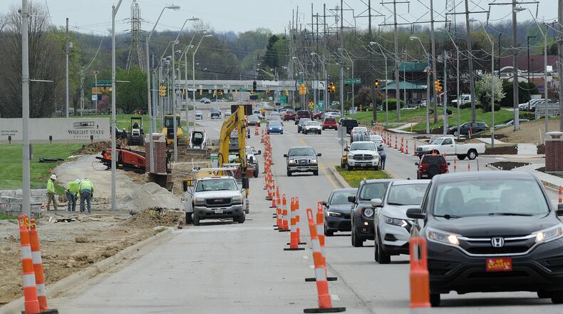 Crews are working to complete a $2.3 million traffic safety project along Colonel Glenn Highway near Wright State University in Fairborn. The project includes installing sidewalks, bike path and pedestrian access along the busiest traffic corridor in the city. MARSHALL GORBY\STAFF