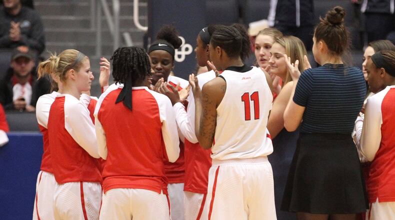 Dayton players huddle before a game against Duquesne on Jan. 31, 2018, at UD Arena. David Jablonski/Staff