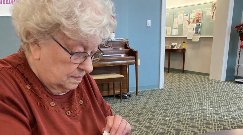 Sister Mary Lou Schmersal labeling makeup remover wipes with the National Human Trafficking Hotline phone number as part of the Dayton SOAP (Save Our Adolescents from Prostitution) Project. She was among the Sisters of the Precious Blood at Salem Heights in Trotwood labeling 3,000 makeup remover wipes. CONTRIBUTED