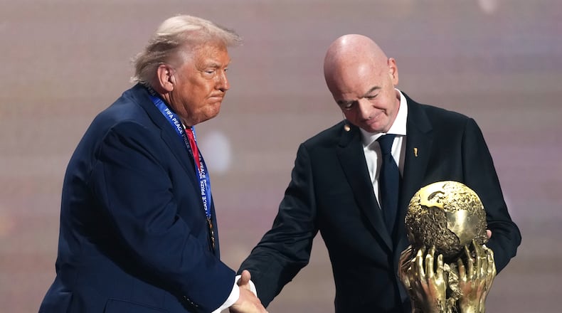 FILE - FIFA President Gianni Infantino presents President Donald Trump with the FIFA Peace Prize during the draw for the 2026 soccer World Cup at the Kennedy Center in Washington, Friday, Dec. 5, 2025. (AP Photo/Stephanie Scarbrough, Pool, File_