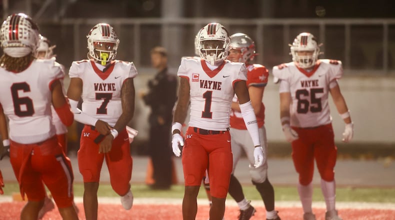 Wayne's Jamier Brown (1) stands in the end zone after a touchdown catch in the first quarter against Troy in a Division I, Region 2 semifinal on Friday, Nov. 14, 2025, at Troy Memorial Stadium. David Jablonski/Staff