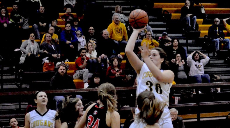 Kenton Ridge center Mikala Morris takes a shot in traffic during the Cougars 56-48 victory over Tecumseh at home Jan. 6, 2018. Nick Dudukovich/CONTRIBUTED