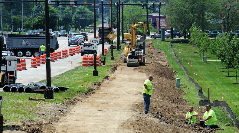 Construction has started on a new Kettering Miami Valley Research Park bike path connector that will help provide links to Centerville and Dayton. This is the north side of Research Boulevard between Woodman Drive and College Drive. MARSHALL GORBY\STAFF