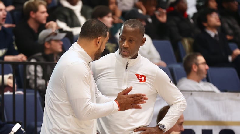 Dayton's Ricardo Greer, left, talks to Anthony Grant during a game against George Washington on Saturday, Jan. 4, 2025, at the Charles E. Smith Center in Washington, D.C. David Jablonski/Staff