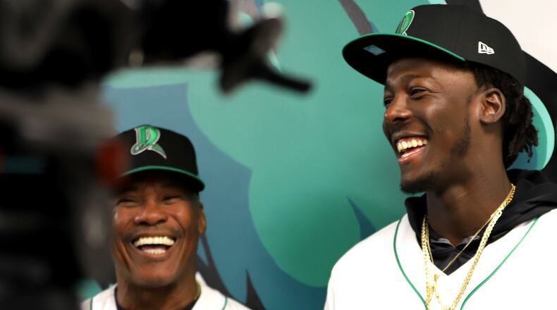 Dragons shortstop Elly De La Cruz met with local media for the first time Wednesday at DayAir Ballpark. Bench coach Juan Samuel (left) translated for De La Cruz. Alexa Sandler/Dayton Dragons