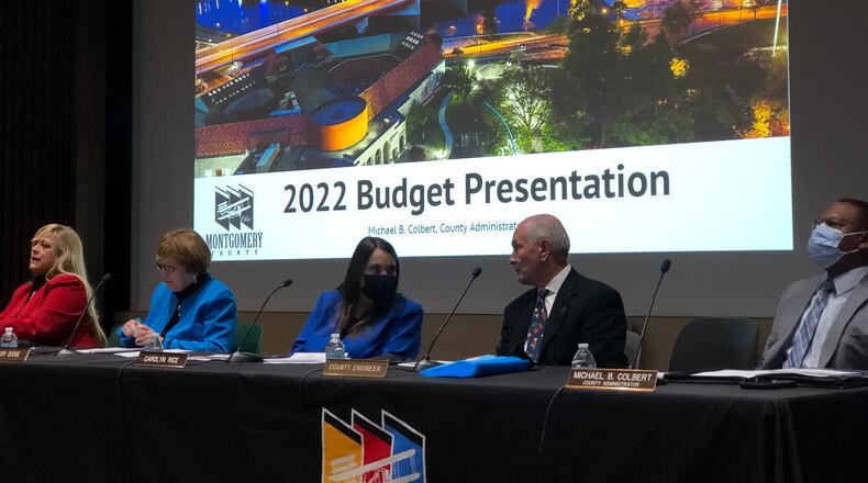From left, Montgomery County commissioners Debbie Lieberman, Judy Dodge and Carolyn Rice discuss the county budget presentation Tuesday with county engineer Paul Gruner and county administrator Michael Colbert. CORNELIUS FROLIK / STAFF