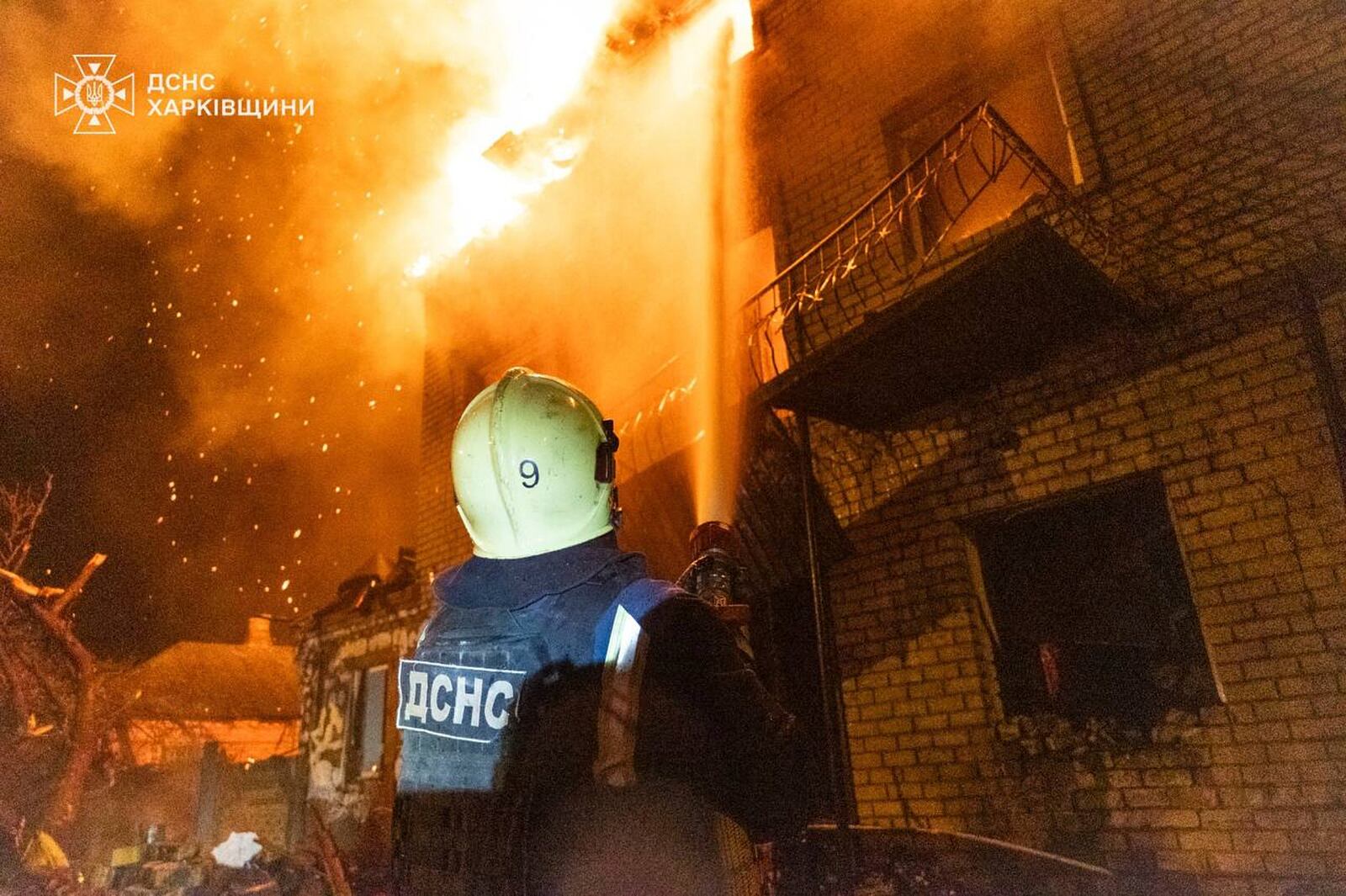 In this photo provided by the Ukrainian Emergency Service, emergency services personnel work to extinguish a fire following a Russian attack in Kharkiv, Ukraine, Wednesday, April 30, 2025. (Ukrainian Emergency Service via AP)