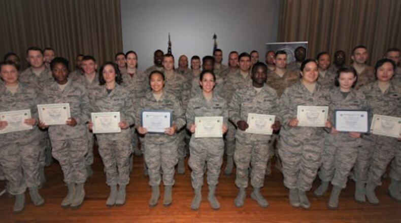 Team Wright-Patterson’s newest enlisted promotees pose for a group photo with Col. David Anzaldua, far left, following a promotion ceremony at the Wright-Patterson Club Nov. 30. (U.S. Air Force photo/Thomas Lewis)