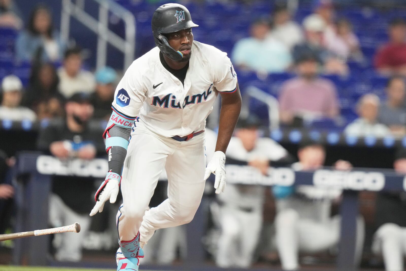 Miami Marlins' Jesus Sanchez drops his bat after hitting a RBI single to score Nick Fortes during the third inning of a baseball game against the Colorado Rockies, Tuesday, June 3, 2025, in Miami. (AP Photo/Lynne Sladky)