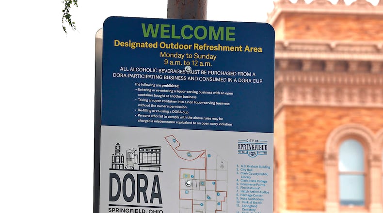Springfield City Commission is considering expanding the Downtown Outdoor Refreshment Area to include as far south as the Clark State Performing Arts Center and north toward the Veterans Park area. The city’s DORA allows patrons to purchase alcohol in specified cups and walk in the designated areas. BILL LACKEY/STAFF