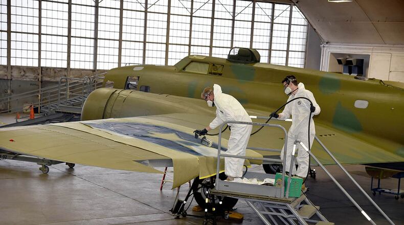 Museum of the U.S. Air Force restoration crews continue the painting process on the Boeing B-17F Memphis Belle. Plans call for the aircraft to be placed on permanent public display in the WWII Gallery at the National Museum of the U.S. Air Force on May 17. (U.S. Air Force photos/Ken LaRock)
