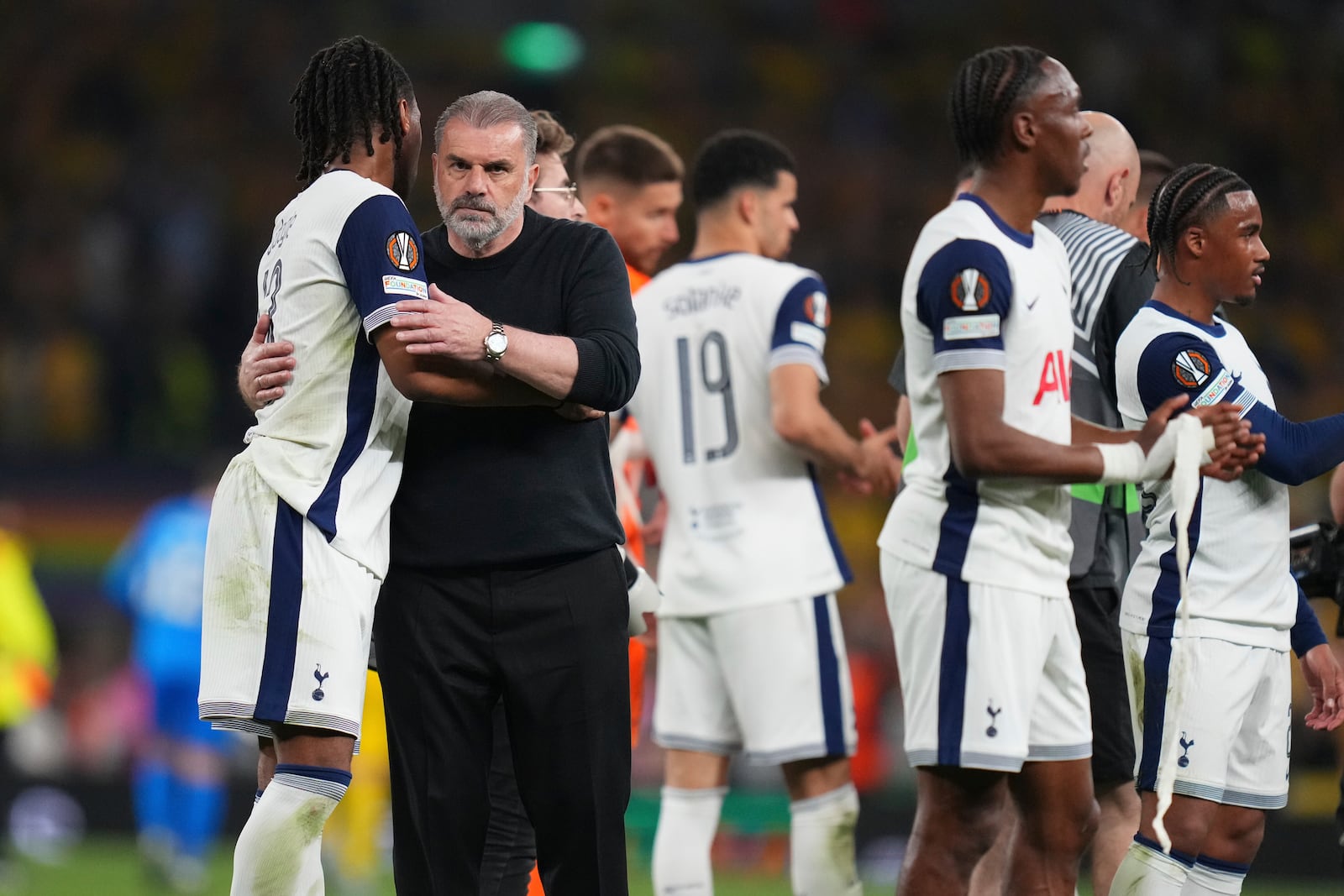 Tottenham's head coach Ange Postecoglou, left, celebrates with players after the Europa League semifinal first leg soccer match between Tottenham Hotspur and Bodo/Glimt at the White Hart Lane stadium in London, Thursday, May 1, 2025. (AP Photo/Kirsty Wigglesworth)