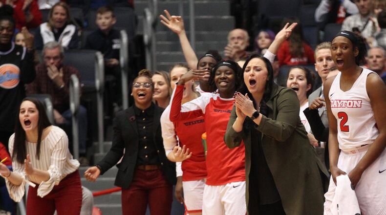 Dayton players and coaches cheer from the bench during a game against Duquesne on Wednesday, Jan. 31, 2018, at UD Arena.