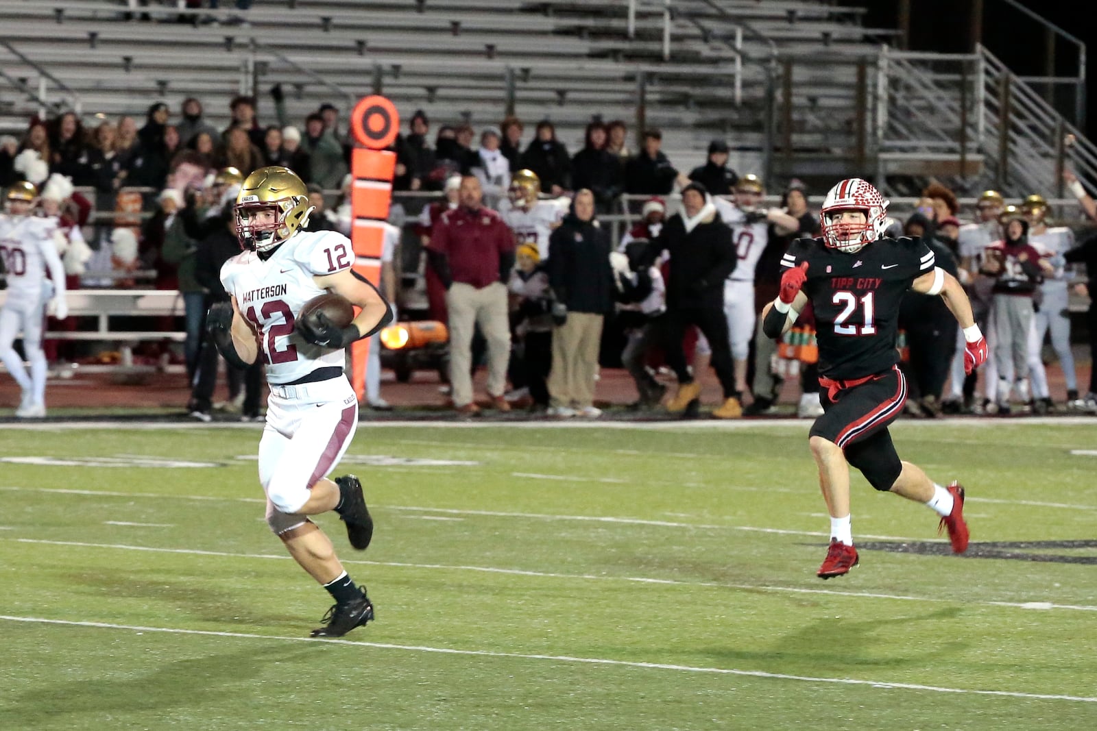 Bishop Watterson's Jack McCoy runs away from Collin Isaac of Tippecanoe on a long touchdown reception during a 41-9 win in a Division III state semifinal game Fri., Nov.  28, 2025, in Mason. STEVEN WRIGHT / STAFF