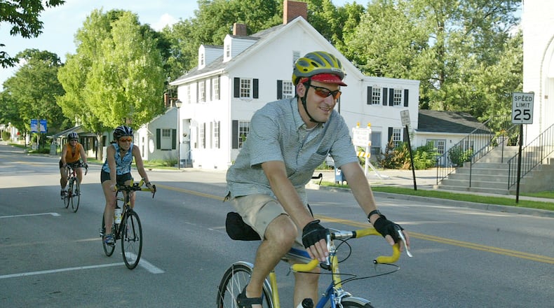 In this file photo a bike rider led a group of riders down Main Street in Springboro The latest Census data shows Springboro saw a 1.4 percent increase in population between 2015 and 2016.
