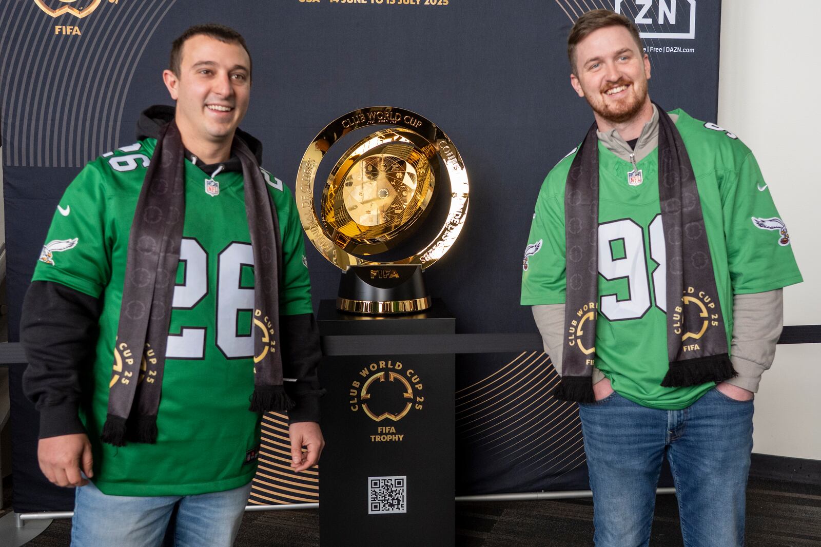 Fans pose with the trophy at a welcoming event for the 2025 FIFA Club World Cup soccer tournament, Thursday, April 10, 2025, in Philadelphia. (AP Photo/Chris Szagola)