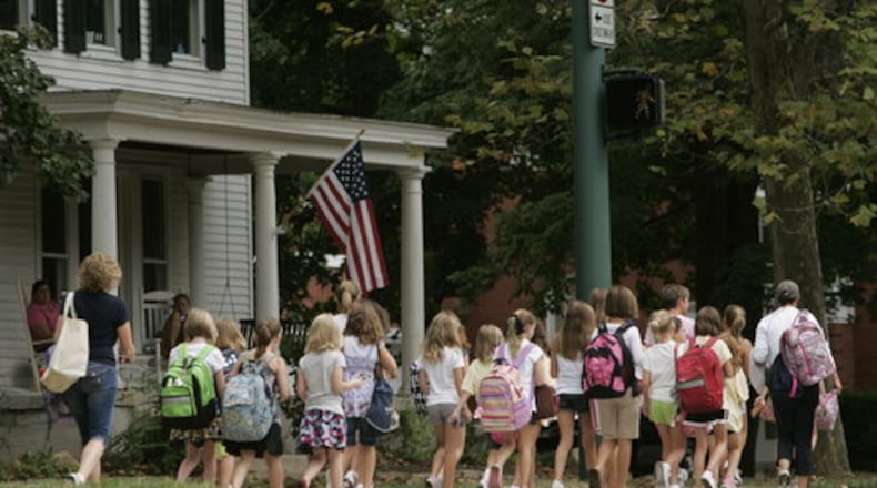 Harman Elementary School students and parents celebrate after the first day of the 2020-21 school year in Oakwood.