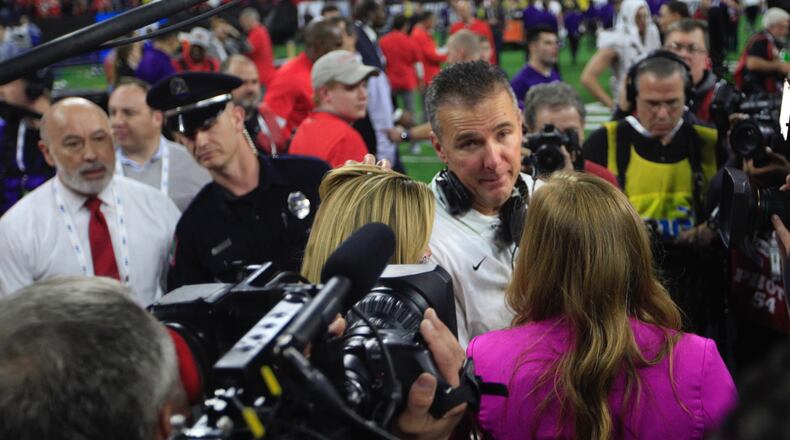 Ohio State’s Urban Meyer talks to a reporter as the Buckeyes celebrate a victory over Northwestern in the Big Ten Championship on Saturday, Dec. 1, 2018, at Lucas Oil Stadium in Indianapolis.