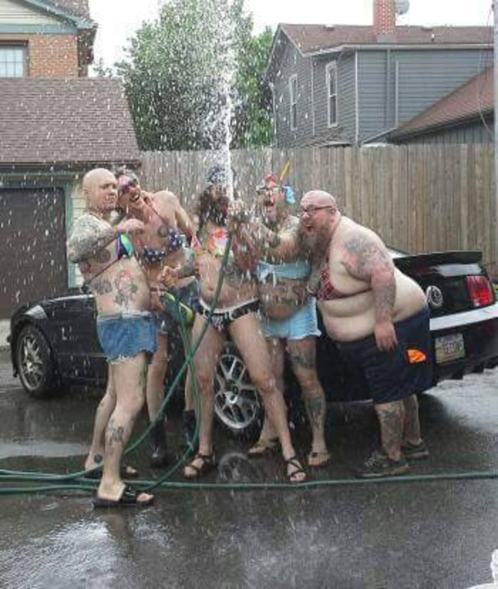 The Tumbleweed Connection 454 E. Fifth St. in Dayton's Oregon District will hold its fifth annual Critter & Car Wash for Charity on Aug. 20, 2017. 
Binki clad men and women wash cars to benefit Adopt-a-Pit and Summit for Soldiers.