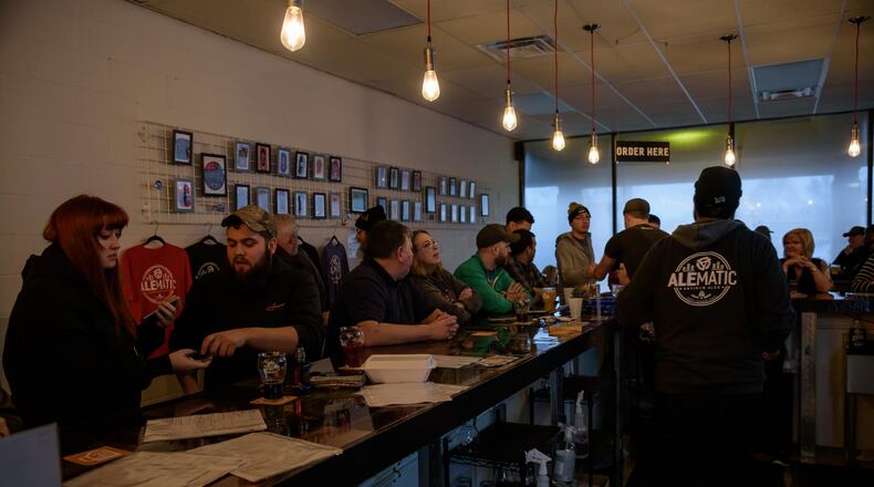 Alematic Artisan Ales, one of the Dayton-area's newest breweries, celebrated its one-year anniversary with a party on Saturday, Feb. 1. The Huber Heights brewery, located at 6182 Chambersburg Road, specializes in craft beers — including small-batch ales, lagers and sours — and also makes their own wines and ciders. TOM GILLIAM / CONTRIBUTING PHOTOGRAPHER