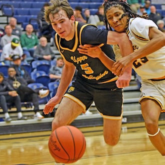 Alter freshman William Peagler Jr. battles Upper Arlington's Charlie Hunt for a loose ball during the Knights' 49-46 loss Sunday night in Flyin' To The Hoop at Trent Arena. Jeff Gilbert/CONTRIBUTED