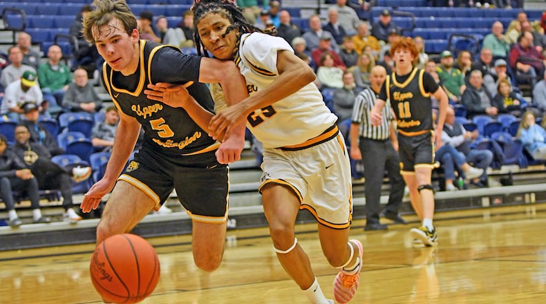 Alter freshman William Peagler Jr. battles Upper Arlington's Charlie Hunt for a loose ball during the Knights' 49-46 loss Sunday night in Flyin' To The Hoop at Trent Arena. Jeff Gilbert/CONTRIBUTED