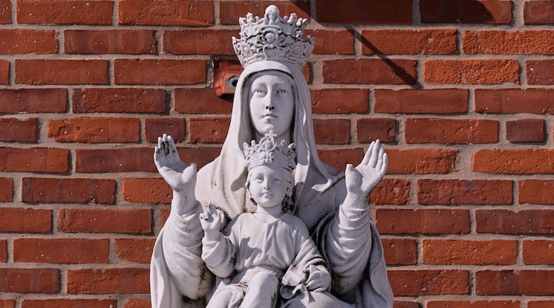 A statue of the Virgin Mary and baby Jesus is displayed outside St. Mary's Church, Tuesday, Feb. 24, 2026, in Cranston, R.I. (AP Photo/Charles Krupa)