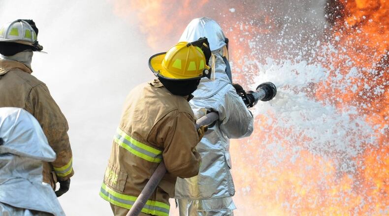 In this 2015 file photo, U.S. Air Force and New Jersey state fire protection specialists from the New Jersey Air National Guard's 177th Fighter Wing battle a simulated aircraft fire with Aqueous Film Forming Foam at Military Sealift Command Training Center East in Freehold, N.J. on June 12. (U.S. Air National Guard photo by Airman 1st Class Amber Powell/Released)